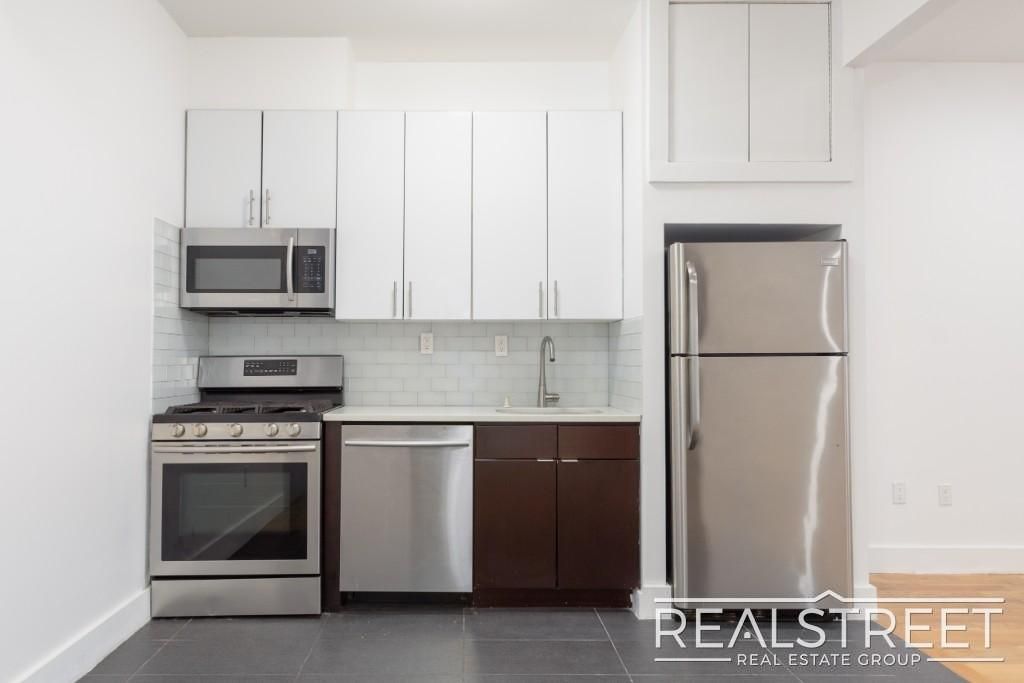Photo of 9002 Queens Blvd #327, ELMHURST, NY 11373 (MLS # 11741595)