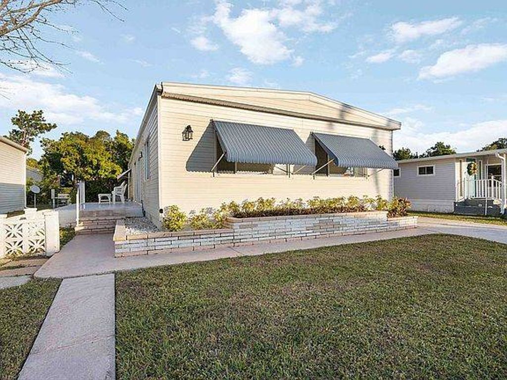 Photo of 8411 Morgan Dr, Sarasota, FL 34238 (MLS # 11678375)