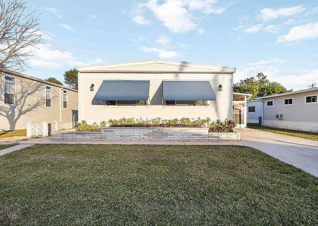 Photo of 8411 Morgan Dr, Sarasota, FL 34238 (MLS # 11678375)