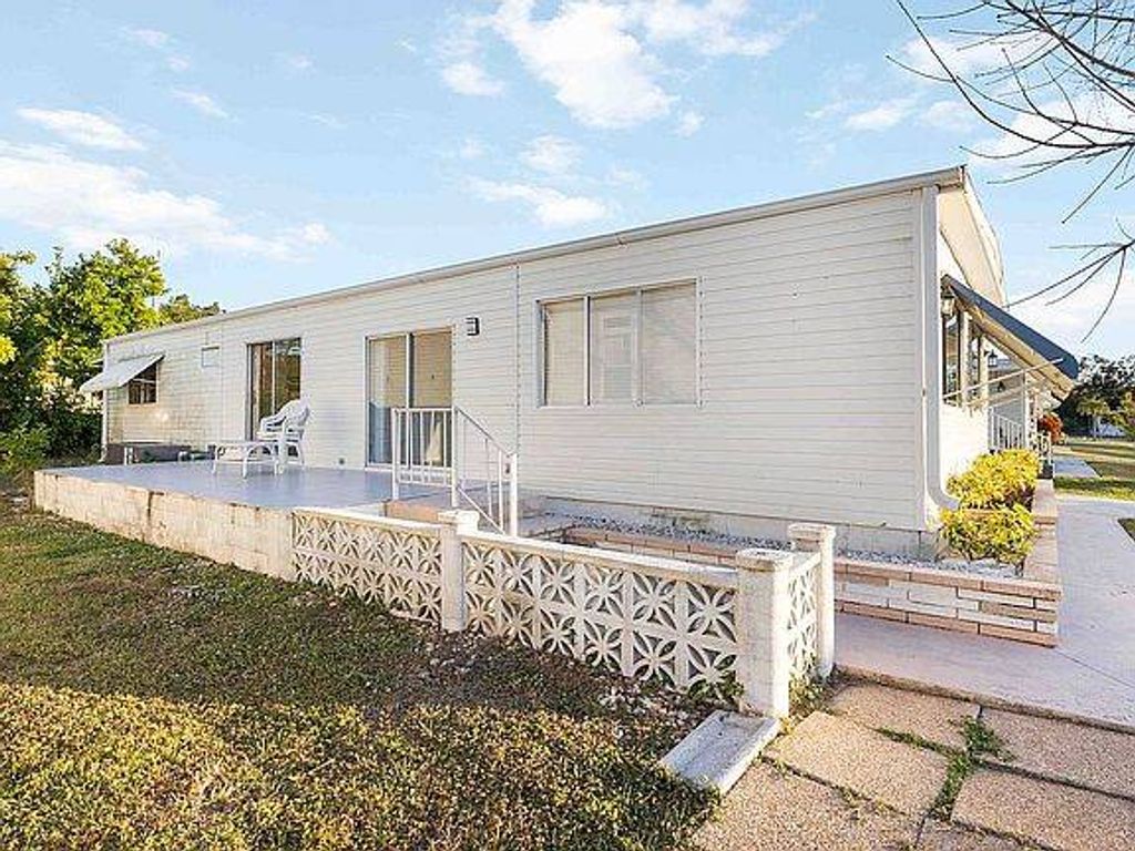 Photo of 8411 Morgan Dr, Sarasota, FL 34238 (MLS # 11678375)