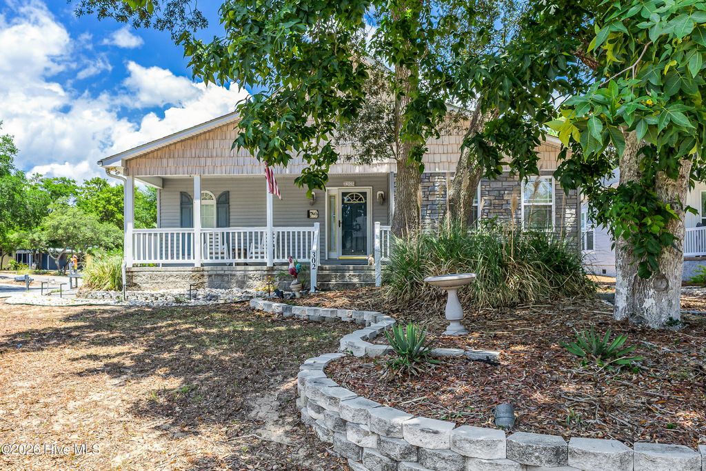 Photo of 302 E Oak Island Drive, Oak Island, NC 28465 (MLS # 100583073)