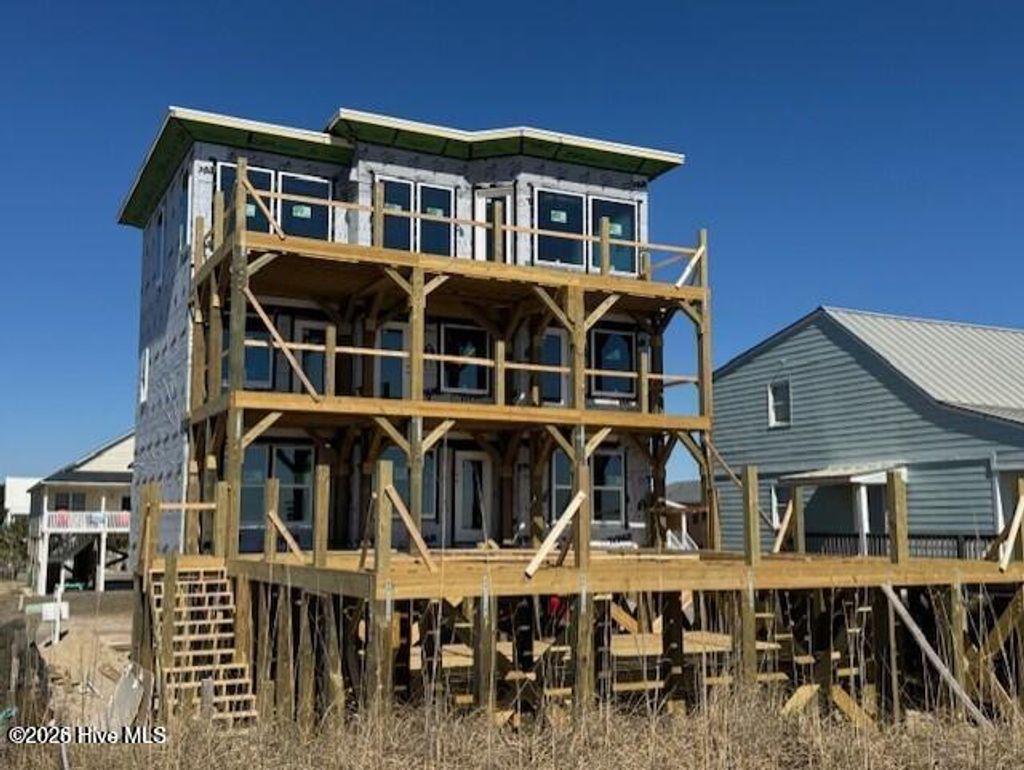 Photo of 617 E Beach Drive, Oak Island, NC 28465 (MLS # 100552652)