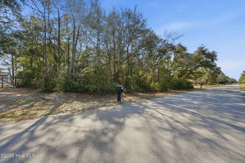 Photo of 142 NW 1st Street, Oak Island, NC 28465 (MLS # 100559673)