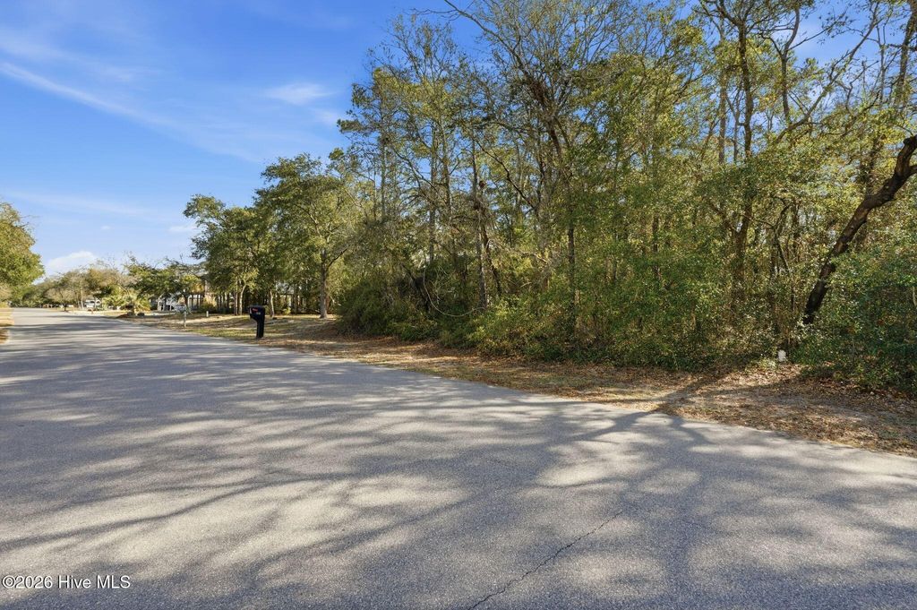 Photo of 142 NW 1st Street, Oak Island, NC 28465 (MLS # 100559673)