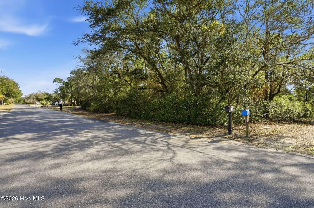 Photo of 142 NW 1st Street, Oak Island, NC 28465 (MLS # 100559673)