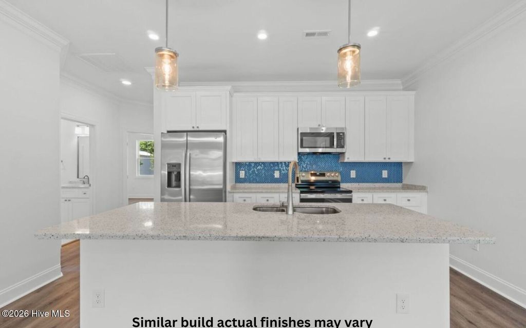 Photo of 130 NE 75th Street, Oak Island, NC 28465 (MLS # 100570970)