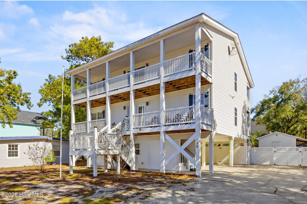 Photo of 128 NW 10th Street, Oak Island, NC 28465 (MLS # 100613132)
