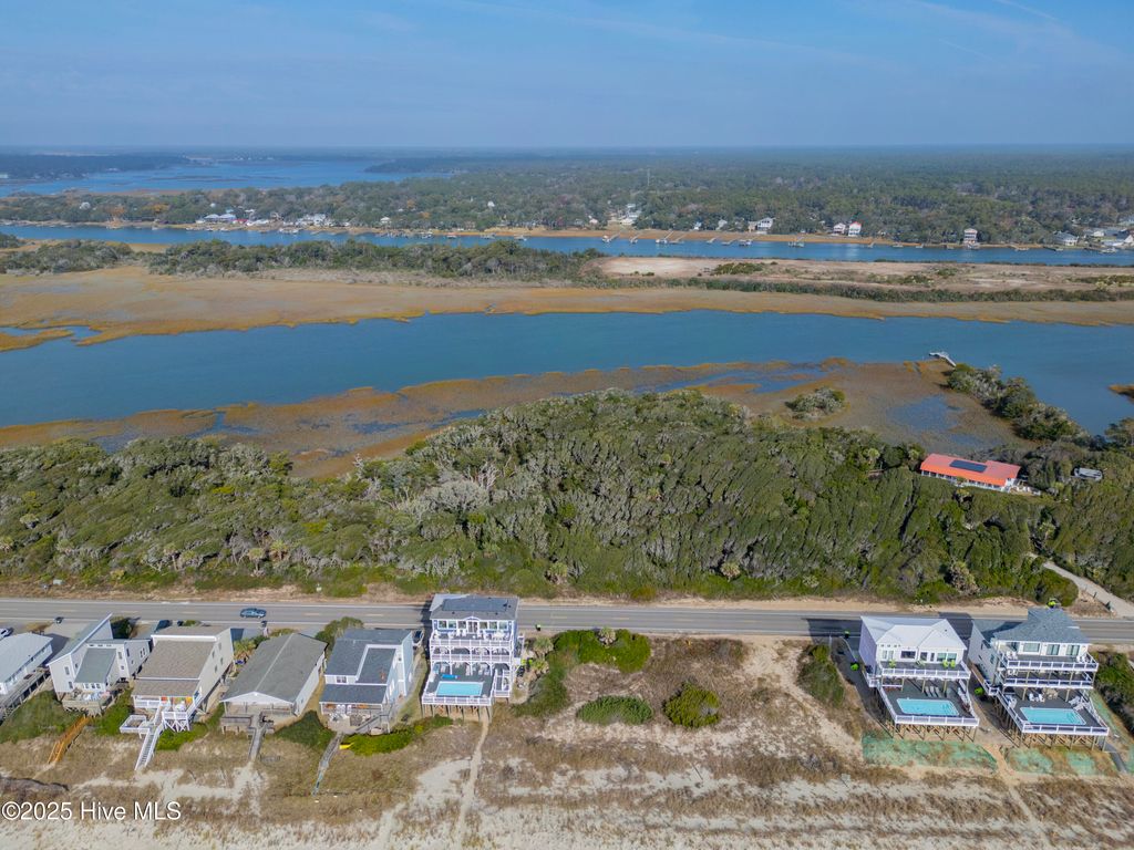 Photo of 9 W Beach Drive, Oak Island, NC 28465 (MLS # 100544468)
