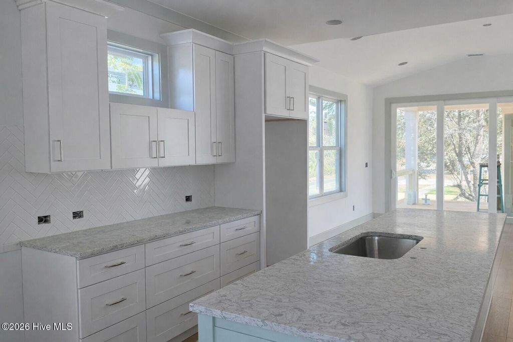 Photo of 98 SE 43rd Street, Oak Island, NC 28465 (MLS # 100557315)