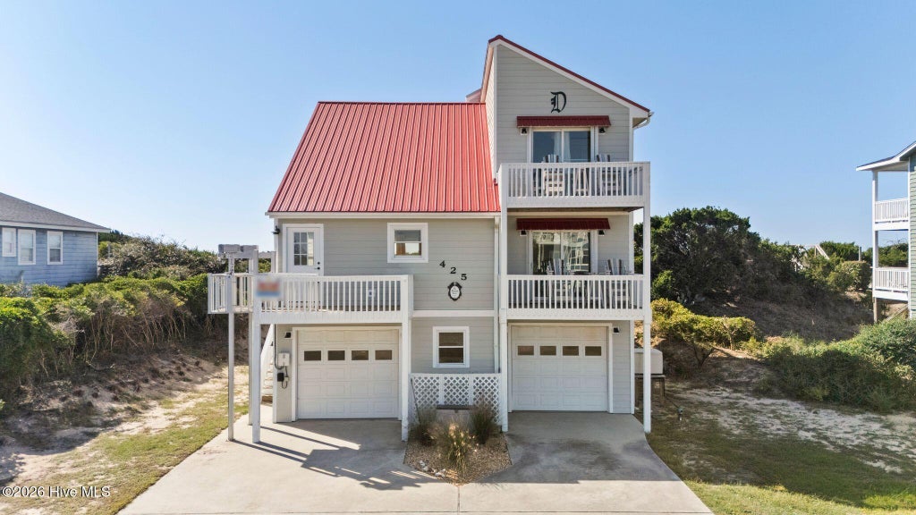 Photo of 425 Caswell Beach Road, Oak Island, NC 28465 (MLS # 100611200)