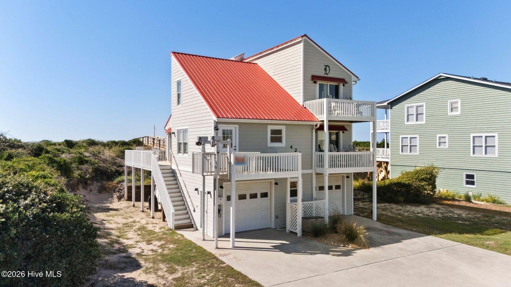 Photo of 425 Caswell Beach Road, Oak Island, NC 28465 (MLS # 100611200)