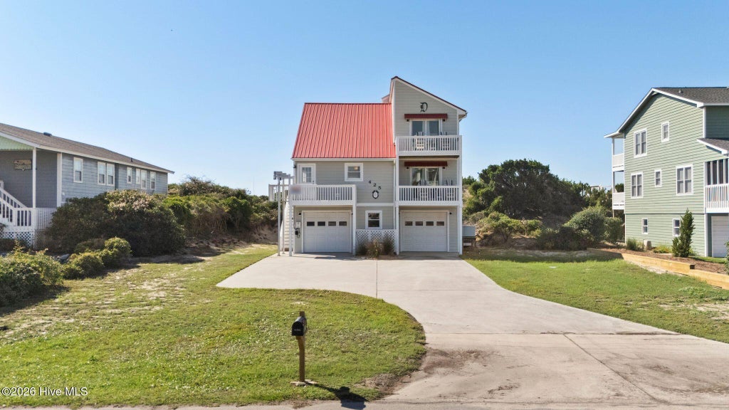 Photo of 425 Caswell Beach Road, Oak Island, NC 28465 (MLS # 100611200)