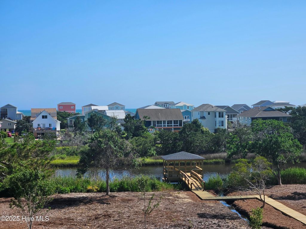 Photo of 107 SE 37th Street, Oak Island, NC 28465 (MLS # 100520602)