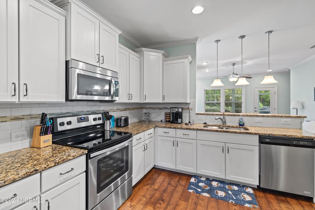 Photo of 3220 Inland Cove Drive, Southport, NC 28461 (MLS # 100568294)