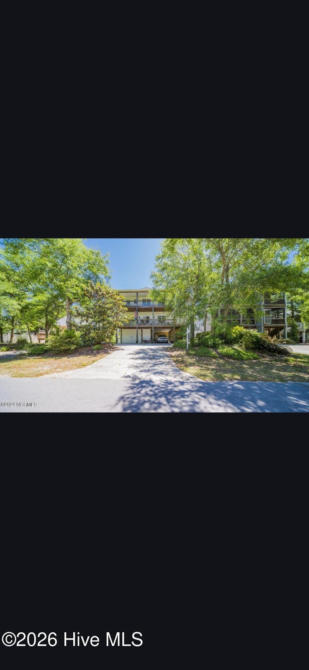 Photo of 104 SW 28th Street, Oak Island, NC 28465 (MLS # 100568411)