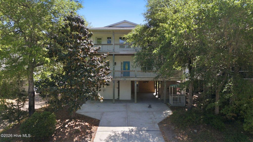 Photo of 104 SW 28th Street, Oak Island, NC 28465 (MLS # 100568411)