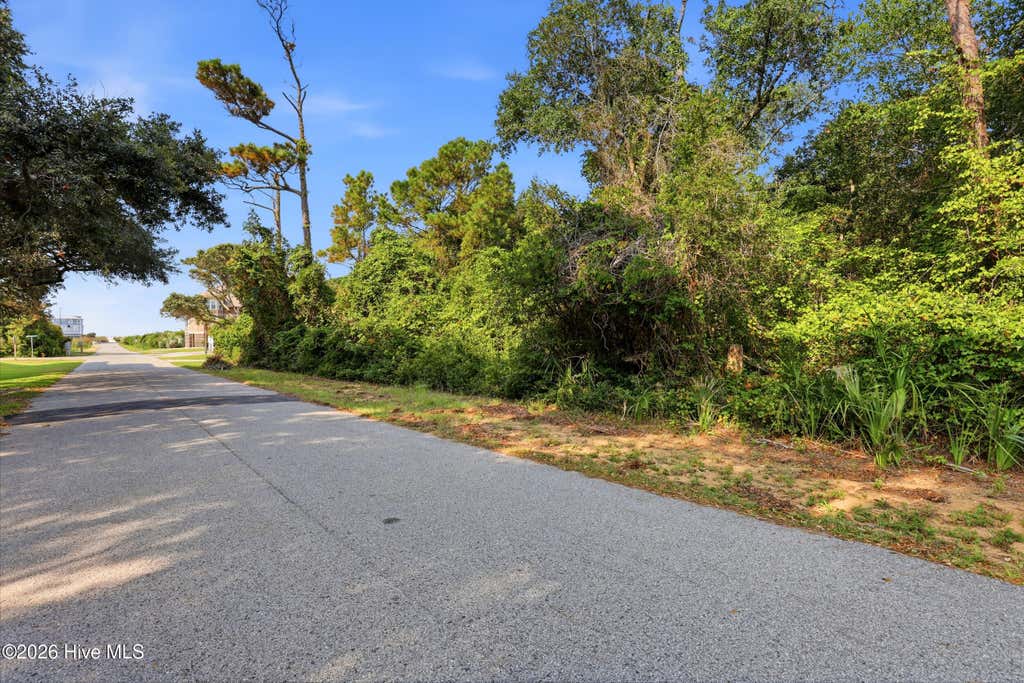 Photo of 107 SE 64th Street, Oak Island, NC 28465 (MLS # 100593037)