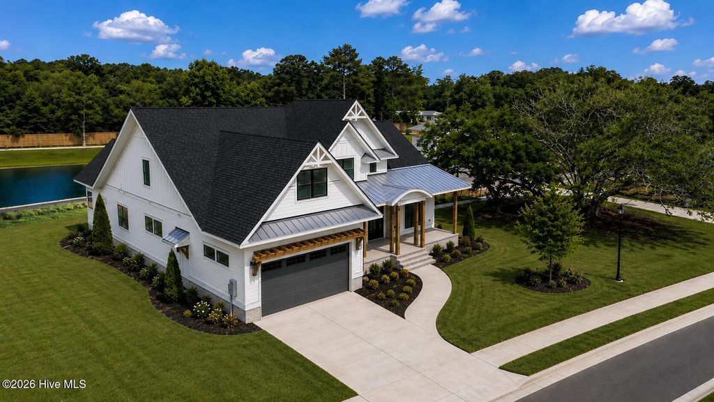 Photo of 322 E Wayfinder Lane, Hampstead, NC 28443 (MLS # 100587453)