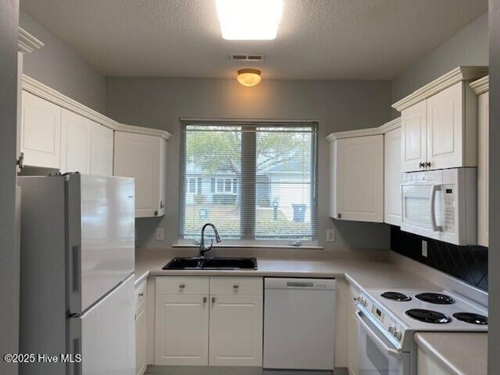 Photo of 253 Bonnet Way SE, Southport, NC 28461 (MLS # 100566935)