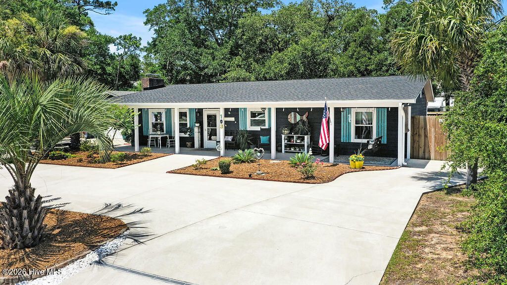 Photo of 103 NW 25th Street, Oak Island, NC 28465 (MLS # 100583916)