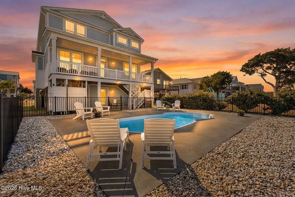 Photo of 3228 E Dolphin Drive, Oak Island, NC 28465 (MLS # 100554481)