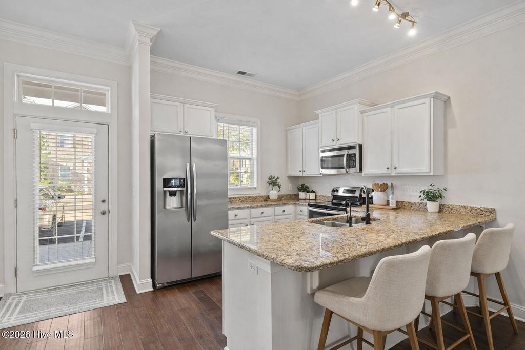 Photo of 4938 Exton Park Loop, Castle Hayne, NC 28429 (MLS # 100561470)