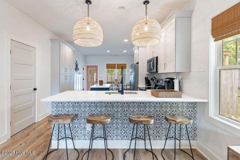 Tiny photo for 127 NW 20th Street, Oak Island, NC 28465 (MLS # 100550551)