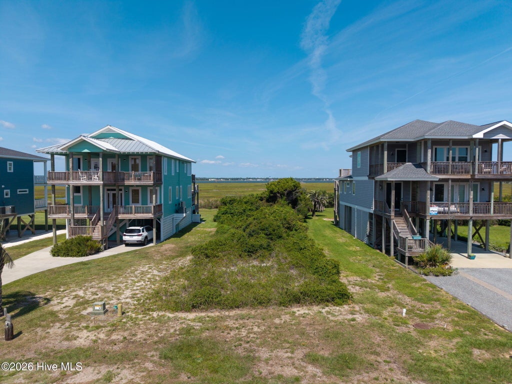 Photo of 128 Caswell Beach Road, Caswell Beach, NC 28465 (MLS # 100610798)