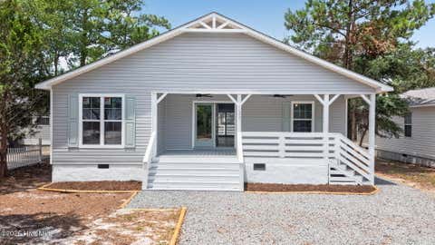 Photo of 137 NE 31st Street, Oak Island, NC 28465 (MLS # 100594615)