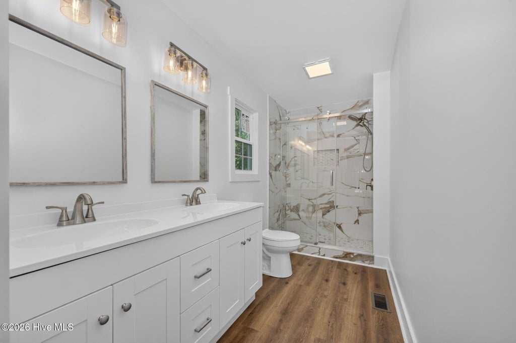Photo of 137 NE 31st Street, Oak Island, NC 28465 (MLS # 100594615)