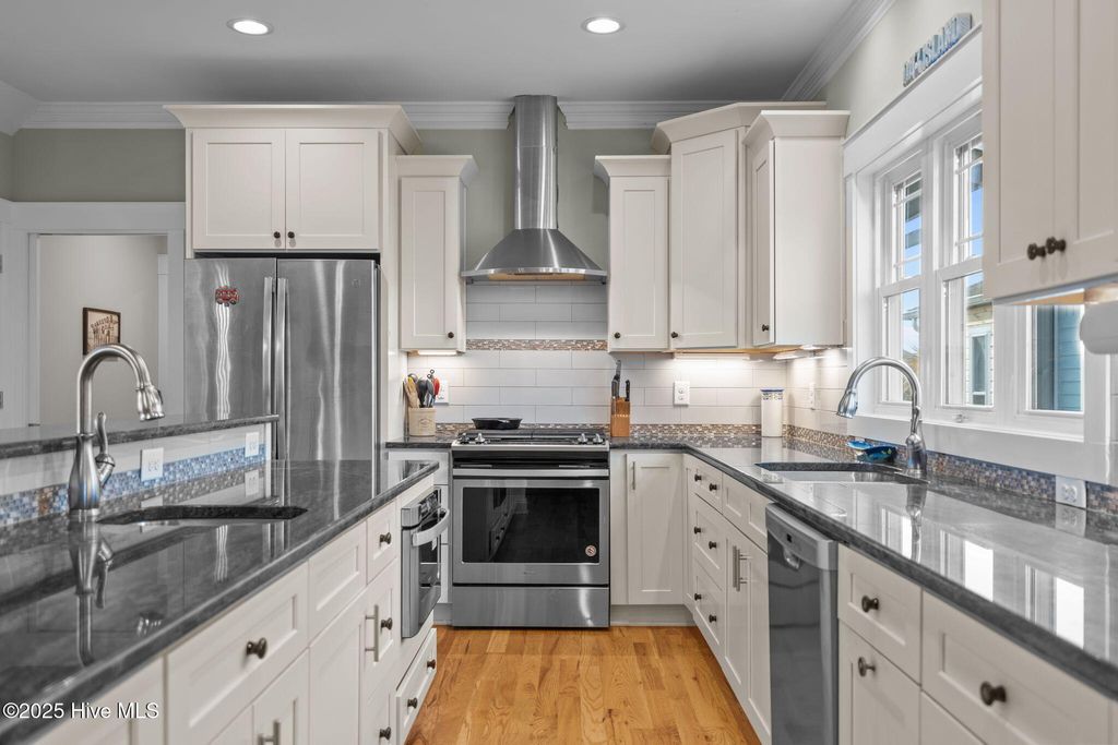 Photo of 1914 E Dolphin Drive, Oak Island, NC 28465 (MLS # 100541907)