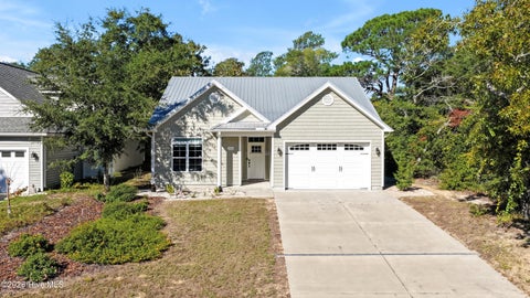 Photo of 115 NE 3rd Street, Oak Island, NC 28465 (MLS # 100610378)