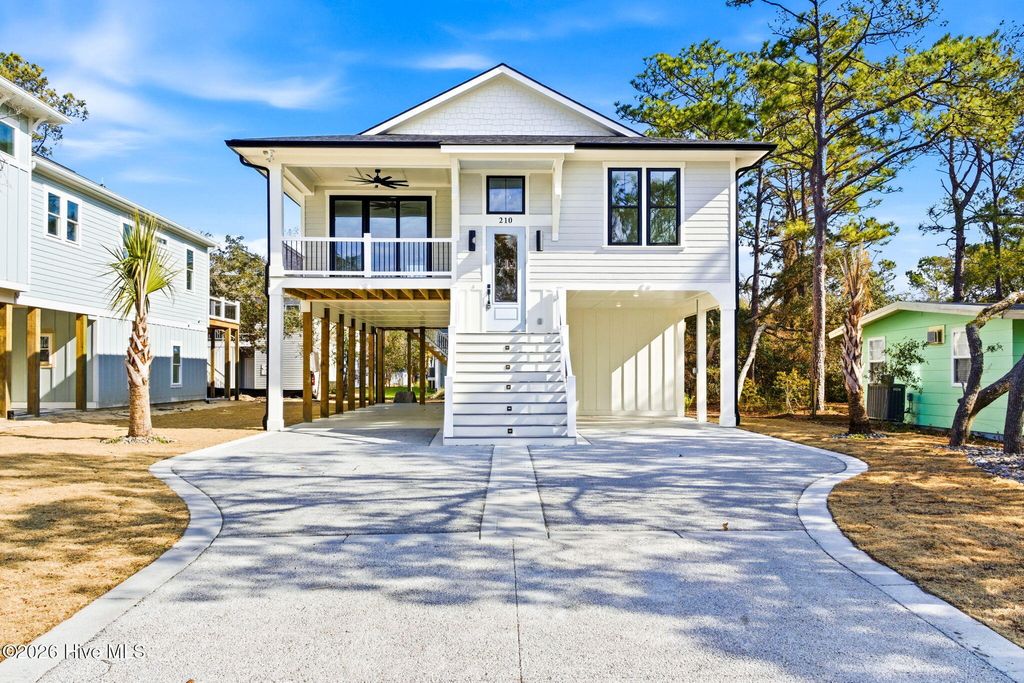 Photo of 210 NE 57th Street, Oak Island, NC 28465 (MLS # 100554131)