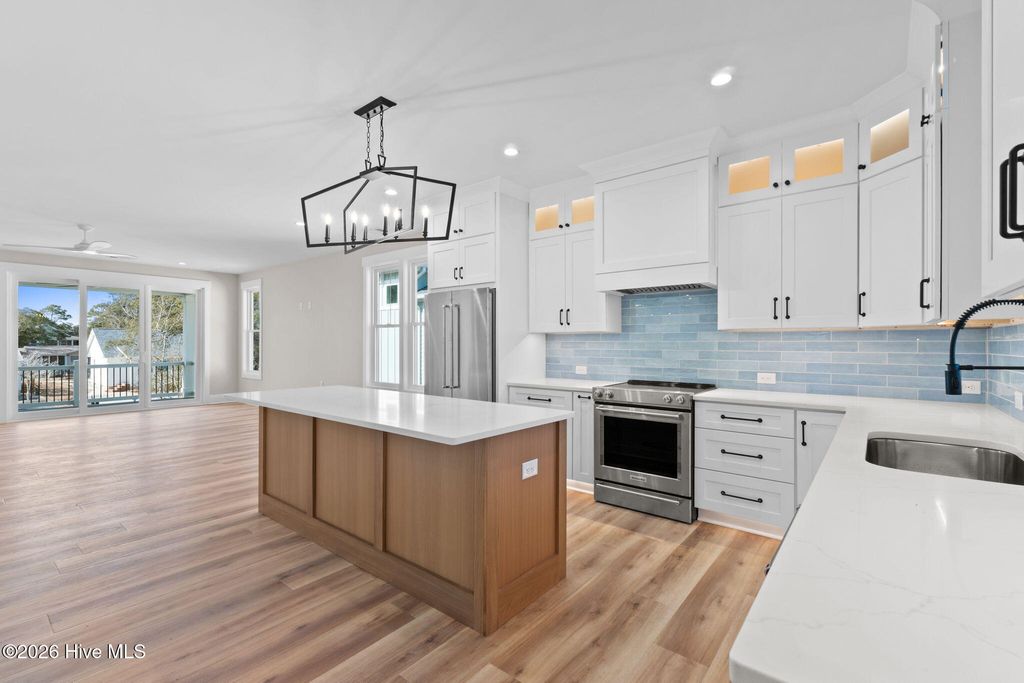 Photo of 210 NE 57th Street, Oak Island, NC 28465 (MLS # 100554131)