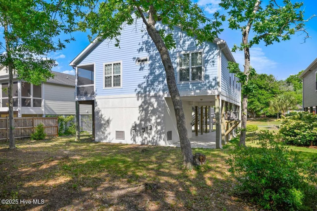 Photo of 407 Womble Street, Oak Island, NC 28465 (MLS # 100541389)