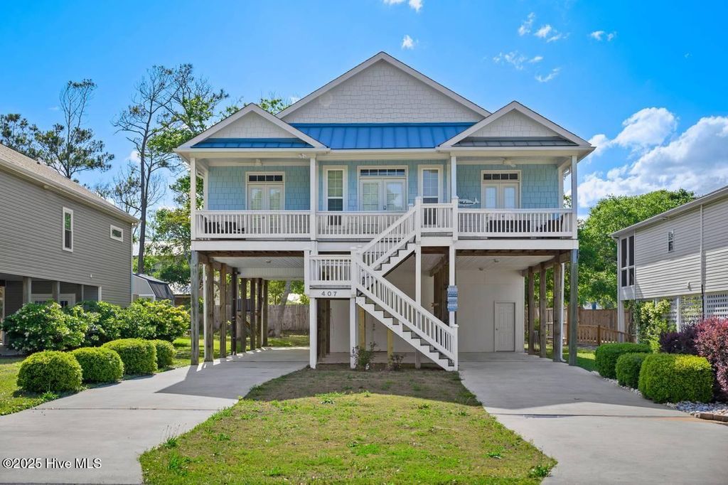 Photo of 407 Womble Street, Oak Island, NC 28465 (MLS # 100541389)