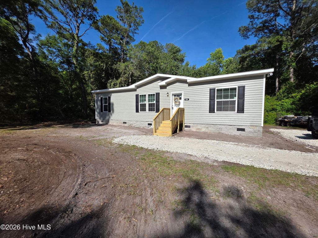 Photo of 409 Pond View Circle, Hampstead, NC 28443 (MLS # 100555925)