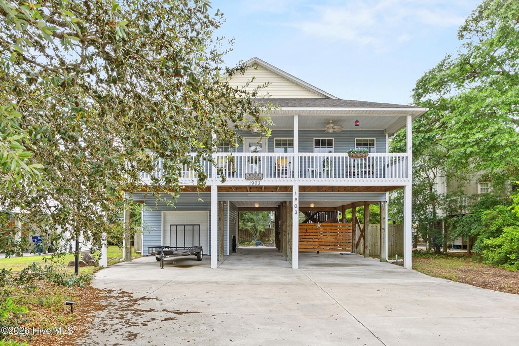 Photo of 1903 E Oak Island Drive, Oak Island, NC 28465 (MLS # 100574651)