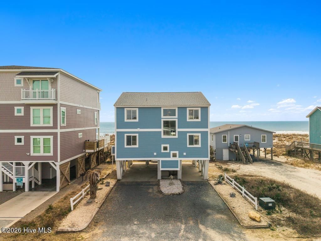 Photo of 1123 E Beach Drive, Oak Island, NC 28465 (MLS # 100556593)