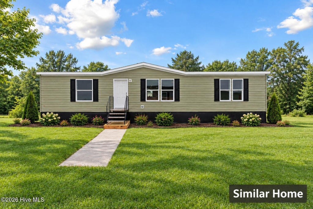 Photo of 927 Mirror Lake Drive, Southport, NC 28461 (MLS # 100604905)