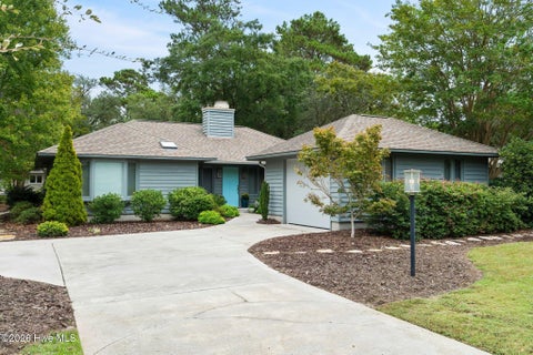 Photo of 606 Wisteria Drive, Sunset Beach, NC 28468 (MLS # 100606372)