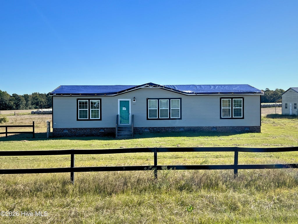 Photo of 229 Rhodes Pond Road, Four Oaks, NC 27524 (MLS # 100612035)