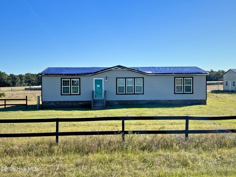 Photo of 229 Rhodes Pond Road, Four Oaks, NC 27524 (MLS # 100612035)