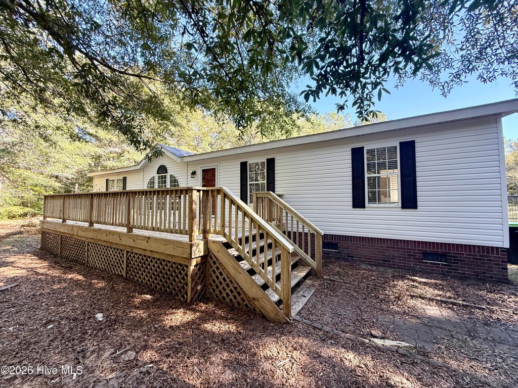 Photo of 7141 Buck Hideway Road NE, Leland, NC 28451 (MLS # 100613455)