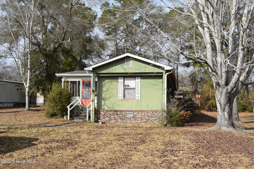 Photo of 821 Magnolia Drive, Sunset Beach, NC 28468 (MLS # 100560485)
