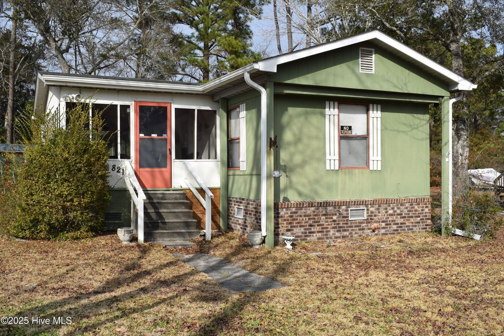 Photo of 821 Magnolia Drive, Sunset Beach, NC 28468 (MLS # 100560485)