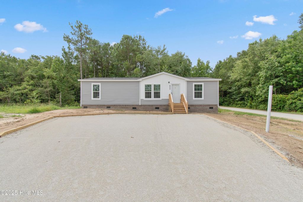 Photo of 6777 Lewis Drive SE, Winnabow, NC 28479 (MLS # 100542017)