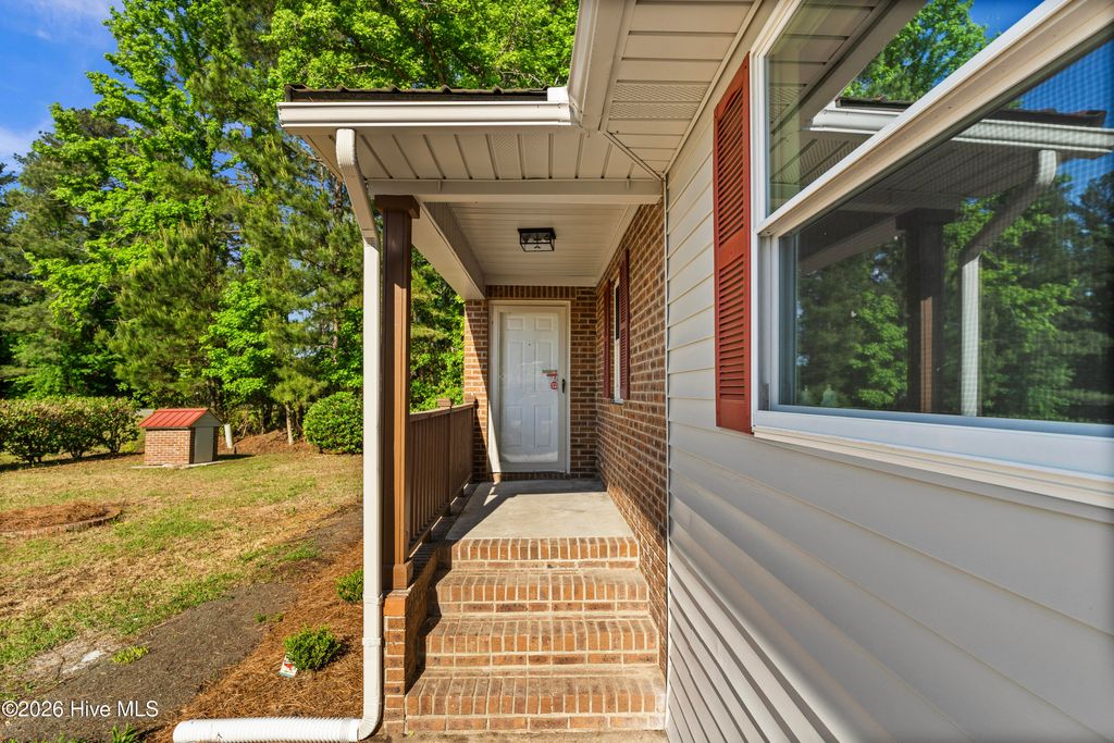 Photo of 11073 Sam Potts Highway, Lake Waccamaw, NC 28450 (MLS # 100569297)