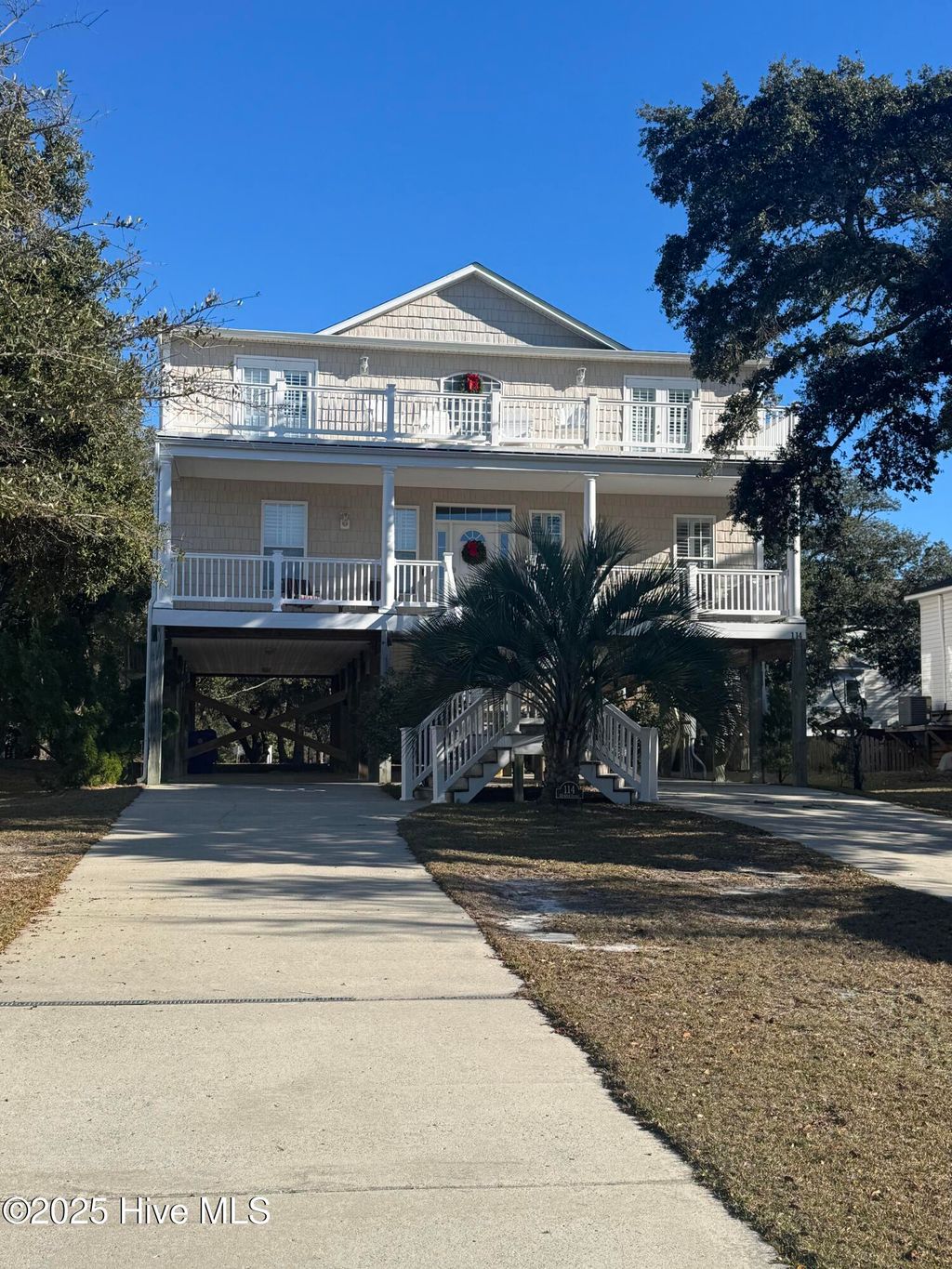 Photo of 114 SE 63rd Street, Oak Island, NC 28465 (MLS # 100522612)