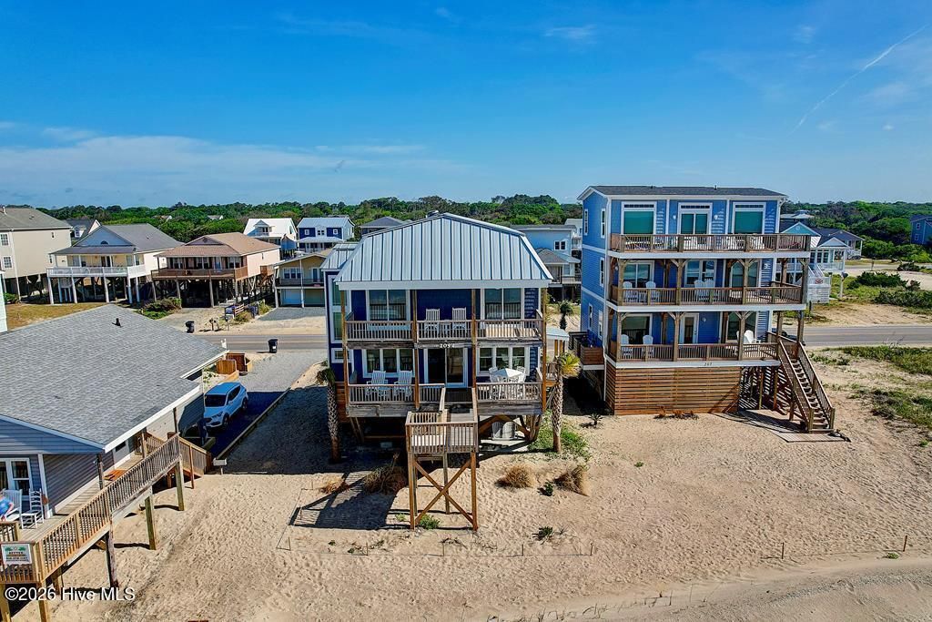 Photo of 209 W Beach Drive, Oak Island, NC 28465 (MLS # 100556591)